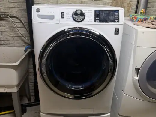 GE front-load washer in a laundry room