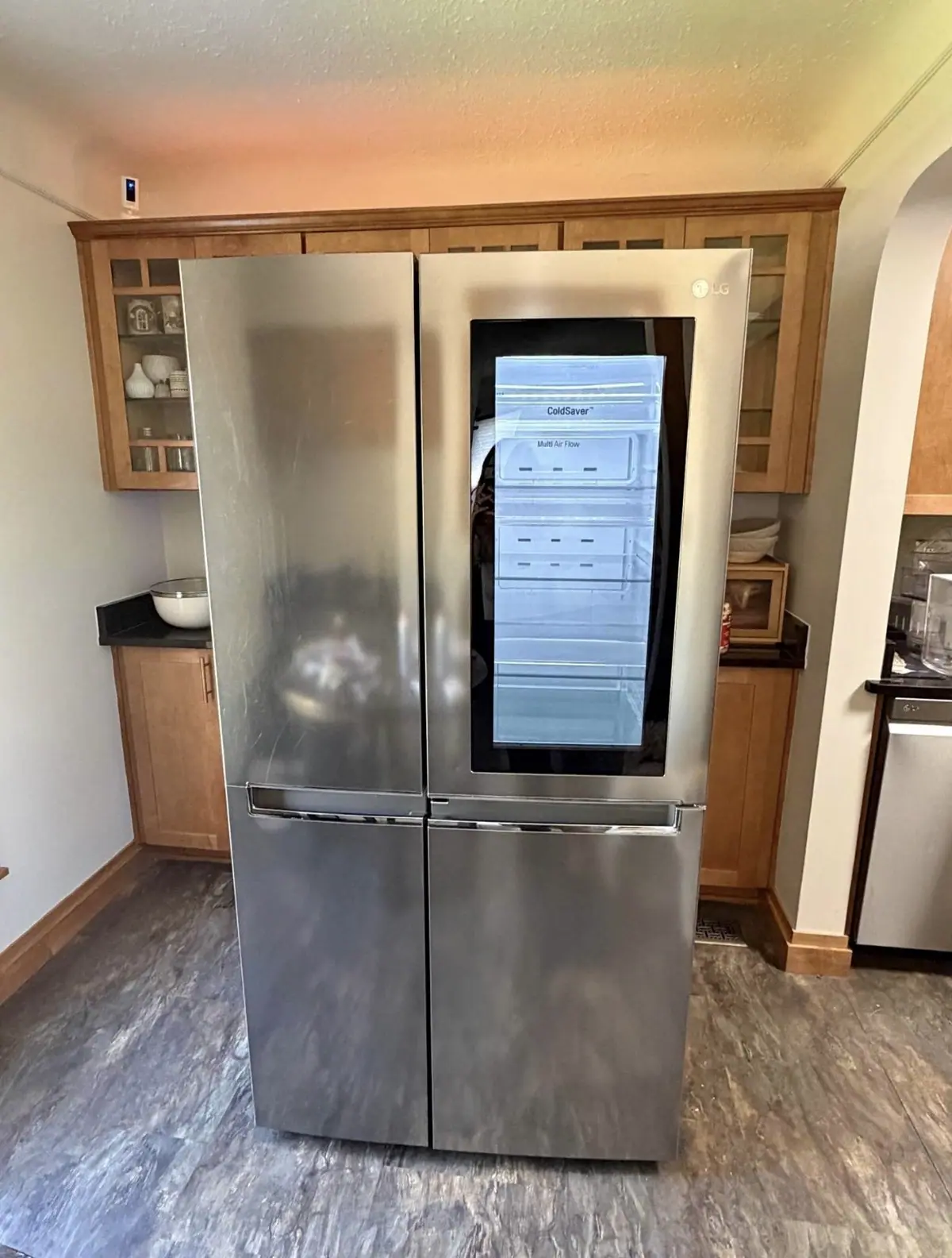 LG side-by-side refrigerator with a glass panel door